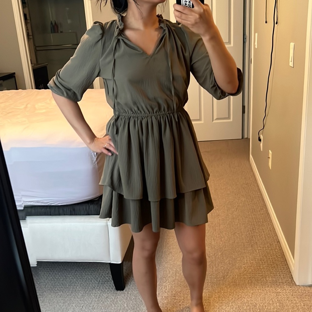 Tiered taupe dress with neck bow.